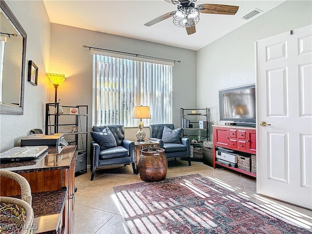 sitting room featuring ceiling fan and light tile patterned floors