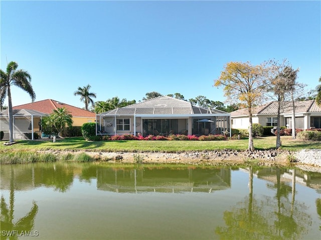 20790 Athenian Ln, North Fort Myers, FL 33917 - exterior space featuring a lanai, a water view, and a lawn