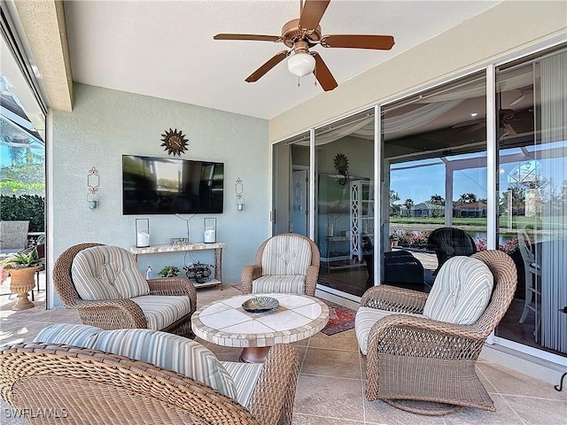 view of patio with outdoor lounge area and ceiling fan