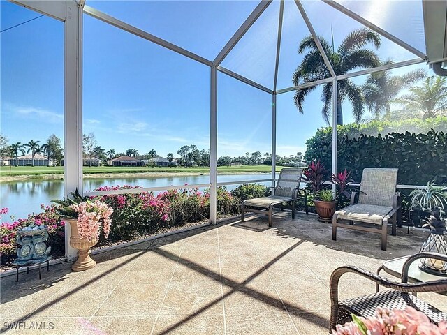 20790 Athenian Ln, North Fort Myers, FL 33917 - view of patio / terrace with a water view and glass enclosure