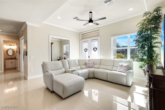 living room featuring ceiling fan and ornamental molding