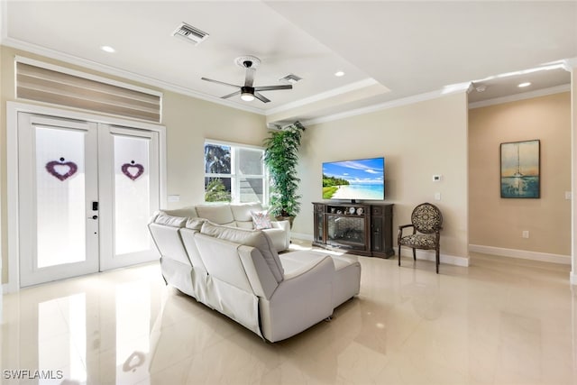 living room with french doors, ceiling fan, and crown molding