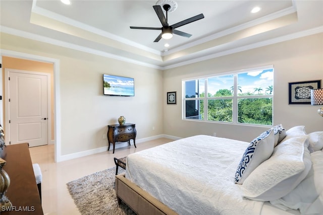 bedroom with crown molding, ceiling fan, and a raised ceiling