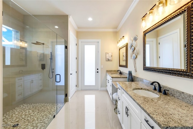 bathroom featuring crown molding, vanity, and a shower with shower door