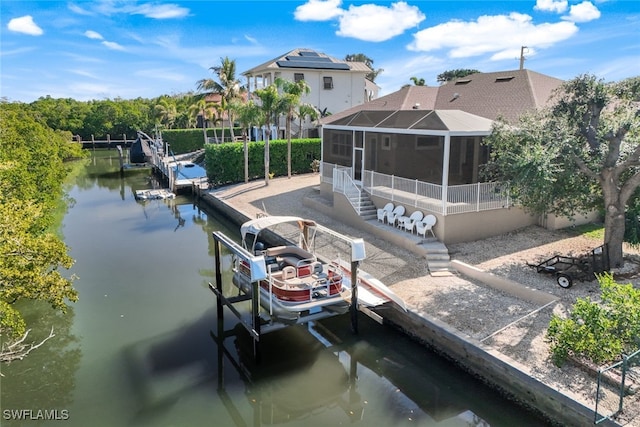 view of dock featuring glass enclosure and a water view