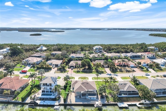 drone / aerial view with a water view