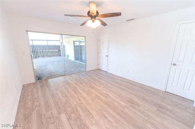 unfurnished room with ceiling fan and light wood-type flooring