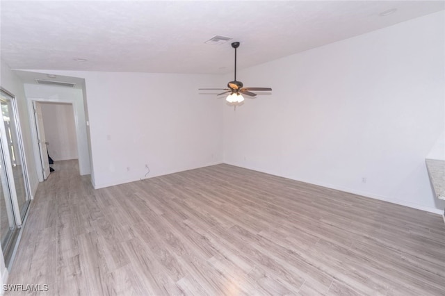 spare room with light hardwood / wood-style floors and ceiling fan