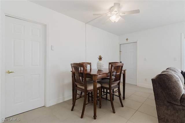 dining room with light tile patterned floors and ceiling fan