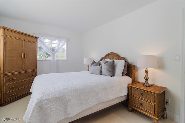 bedroom featuring light tile patterned floors