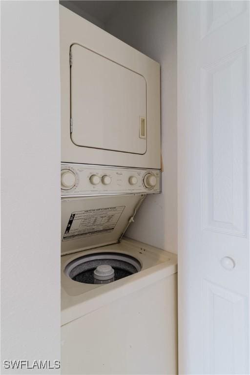 washroom with stacked washer and clothes dryer