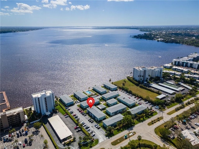 birds eye view of property with a water view