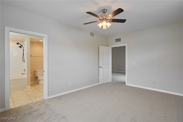 unfurnished bedroom with carpet, visible vents, and baseboards