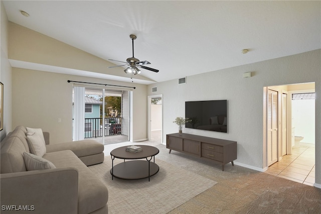 living area featuring vaulted ceiling, carpet, visible vents, and a ceiling fan