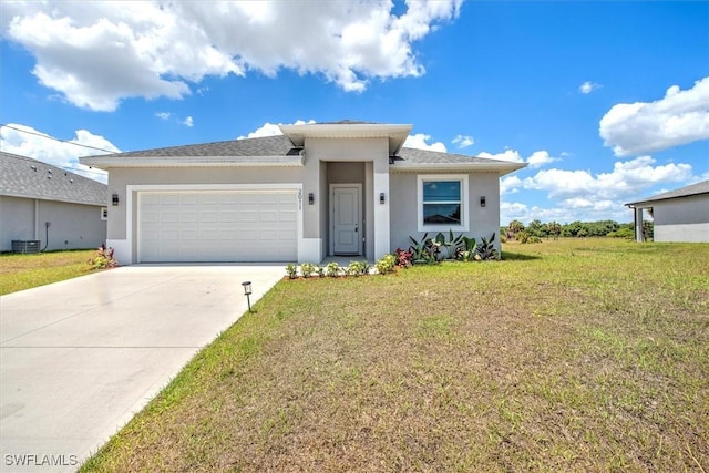 view of front of house featuring a garage, central AC unit, and a front lawn