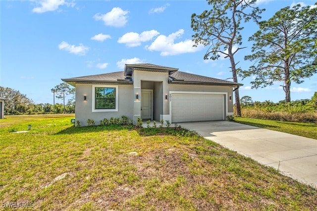 prairie-style home featuring stucco siding, an attached garage, concrete driveway, and a front yard