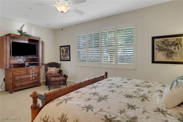 bedroom with ceiling fan and carpet flooring