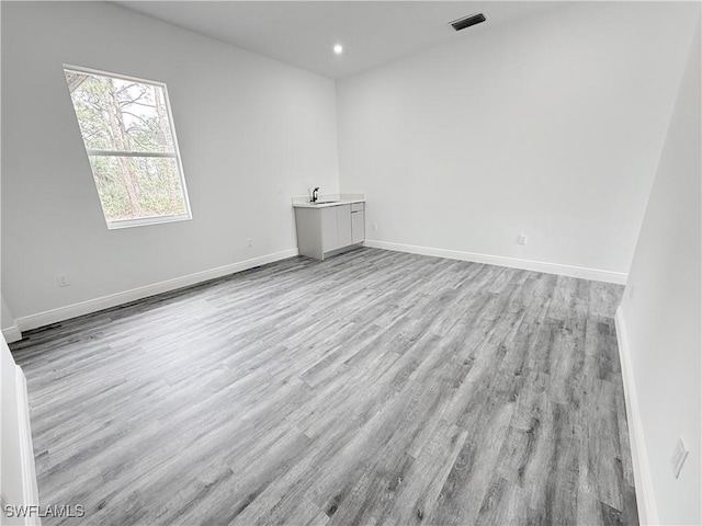 spare room featuring light hardwood / wood-style floors