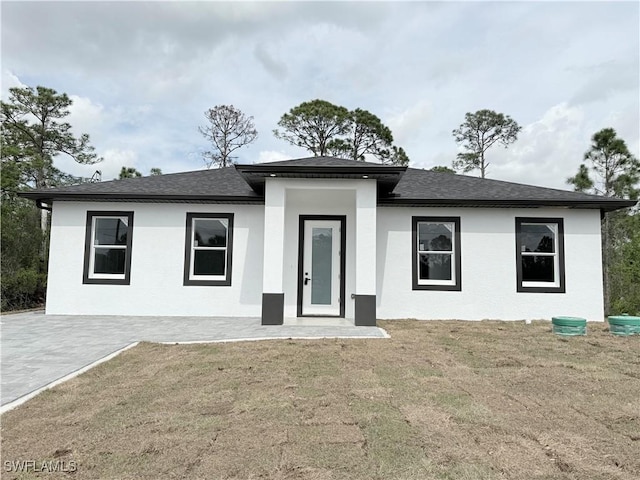 view of front of home with a front yard