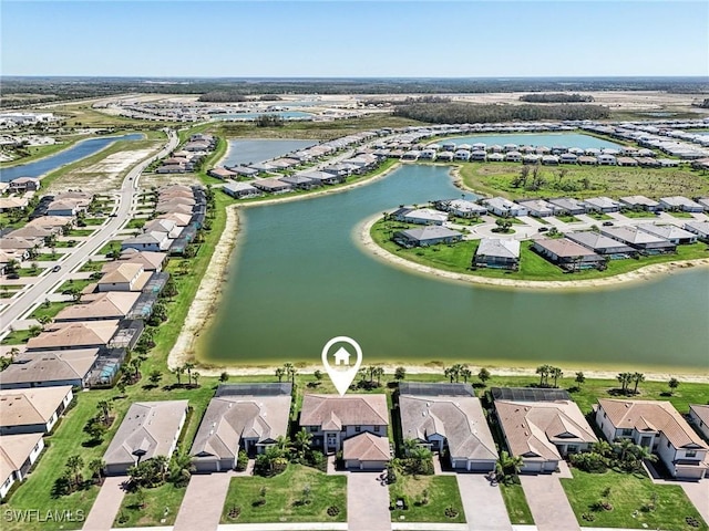 bird's eye view featuring a residential view and a water view