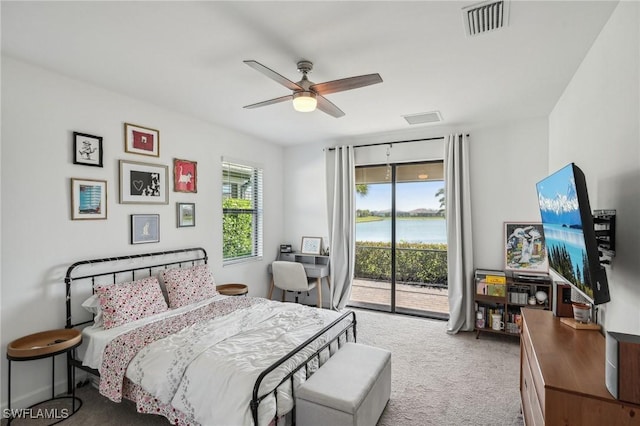 bedroom featuring ceiling fan, visible vents, carpet, and access to exterior