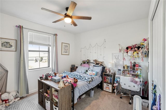 carpeted bedroom featuring ceiling fan