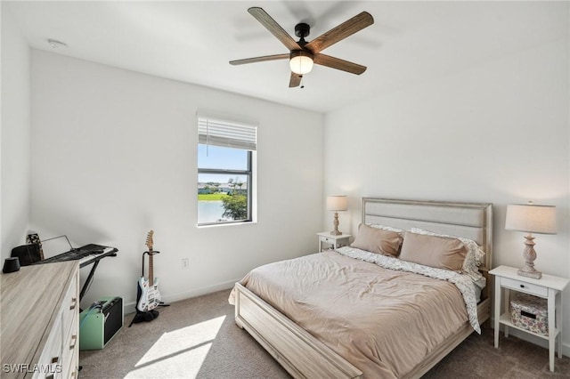 bedroom with carpet flooring, baseboards, and ceiling fan