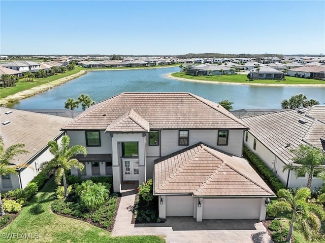 aerial view with a water view and a residential view