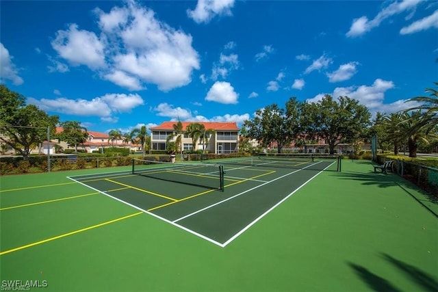 view of sport court featuring fence