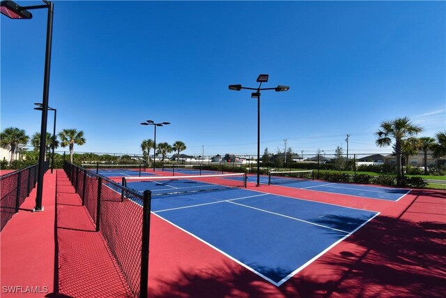 304 Spring Hill Lake Loop, Cape Coral, FL 33993 - view of tennis court with fence and community basketball court