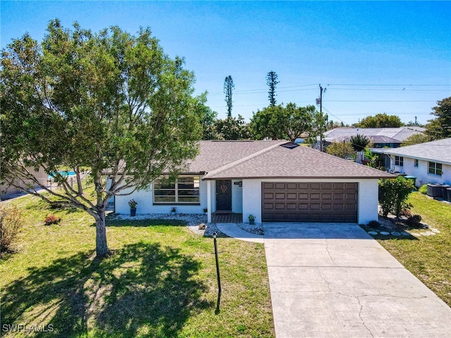 ranch-style home with an attached garage, concrete driveway, a front yard, and stucco siding