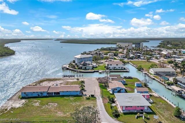 birds eye view of property featuring a residential view and a water view