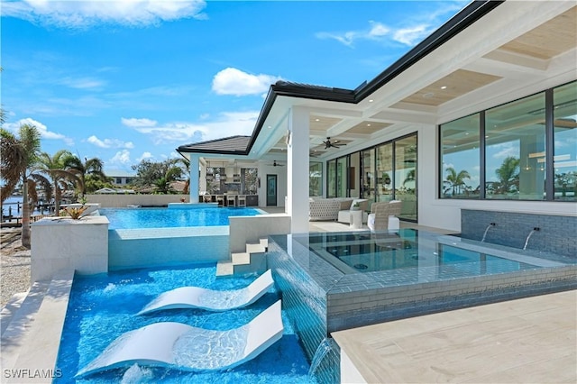 view of swimming pool with a ceiling fan, a fenced in pool, a patio area, and an outdoor hangout area