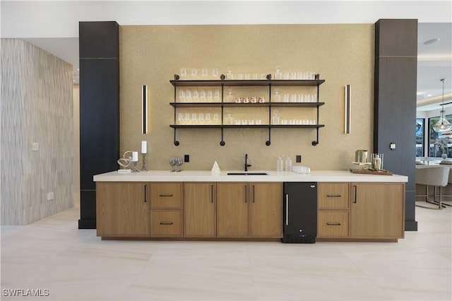 kitchen featuring open shelves, a sink, and light countertops