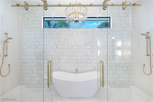 bathroom featuring a freestanding tub, tile patterned flooring, walk in shower, and tile walls