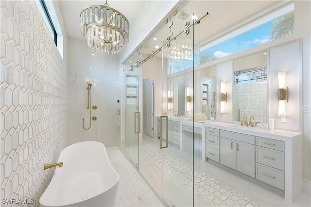 full bathroom featuring a chandelier, a healthy amount of sunlight, a freestanding bath, and a shower stall