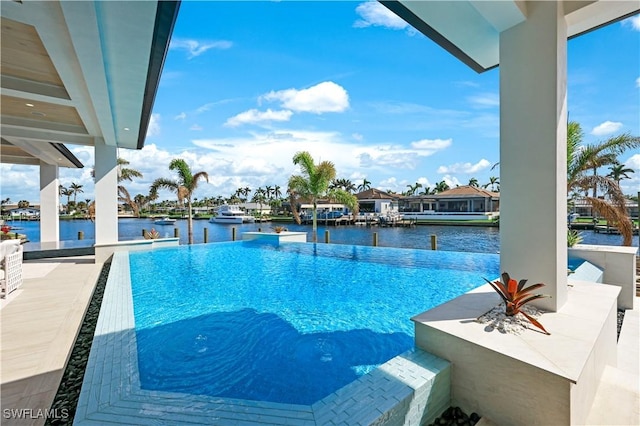 view of swimming pool featuring a water view