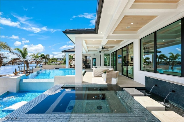 view of swimming pool featuring a patio, an outdoor hangout area, an in ground hot tub, a ceiling fan, and an infinity pool