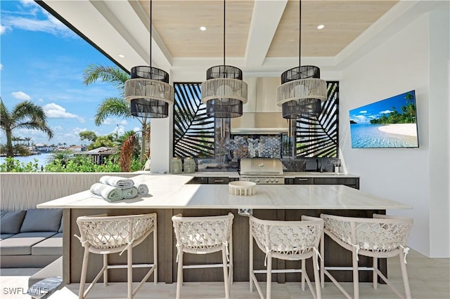 exterior space featuring light stone countertops, wood ceiling, breakfast area, and decorative light fixtures