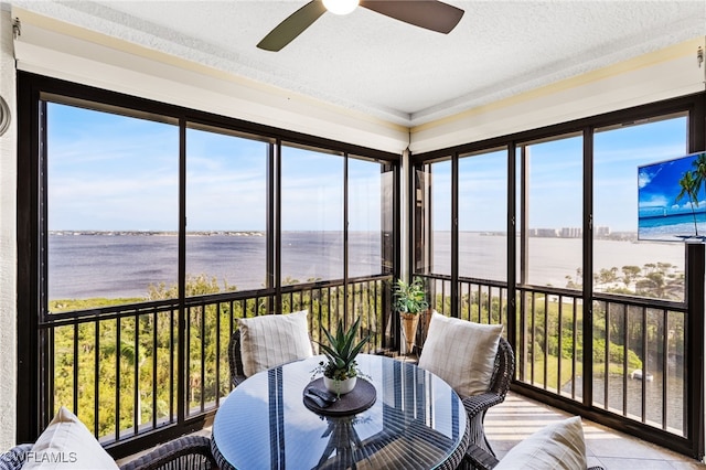 11600 Court Of Palms Unit 606, Fort Myers, FL 33908 - sunroom / solarium with ceiling fan, a textured ceiling, outdoor dining space, and ornamental molding