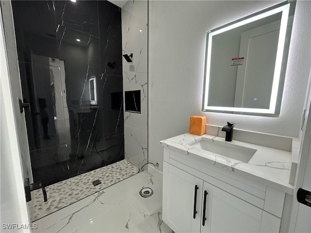 full bathroom with marble finish floor, a marble finish shower, and vanity