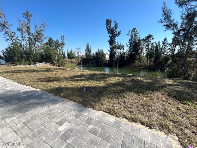 view of yard with a water view