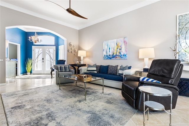 living room featuring arched walkways, a chandelier, tile patterned flooring, french doors, and crown molding