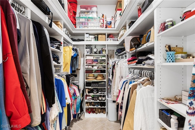 spacious closet featuring tile patterned flooring