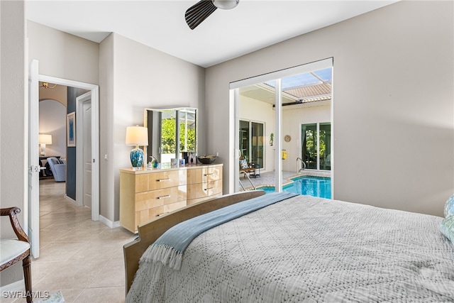 bedroom with baseboards, light tile patterned flooring, and access to exterior