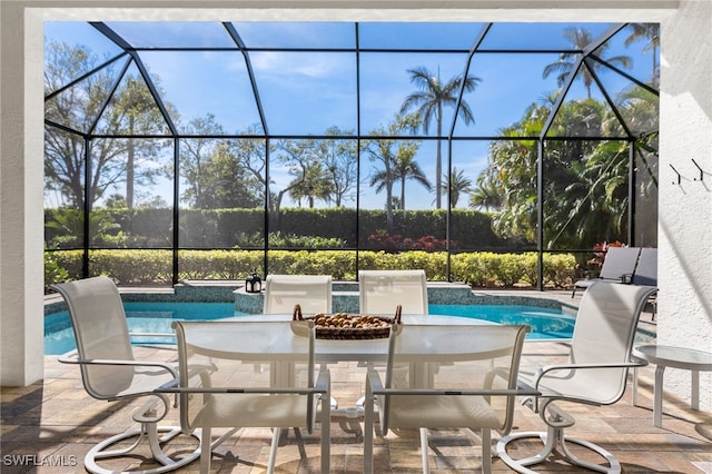 exterior space featuring a fenced in pool, a lanai, and a patio area