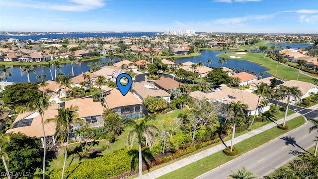 birds eye view of property with a residential view and a water view