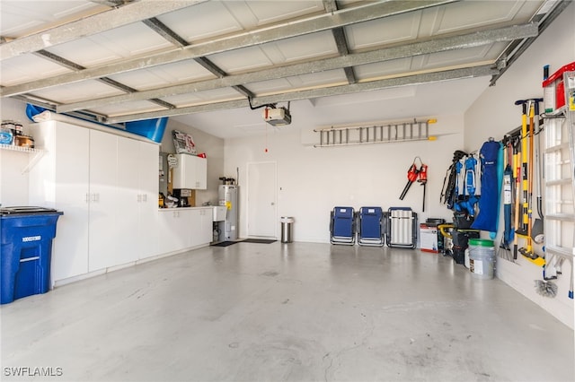 garage with a garage door opener and water heater