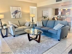 living room with light tile patterned flooring