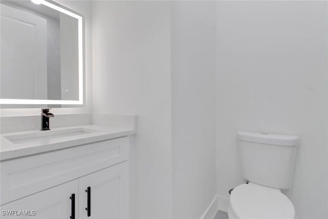 3310 14th St W, Lehigh Acres, FL 33971 - bathroom with vanity and toilet